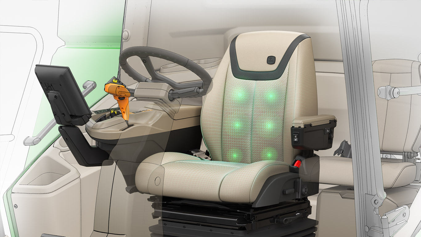 Beige massage seat with black accents installed in a combine's driver's area.